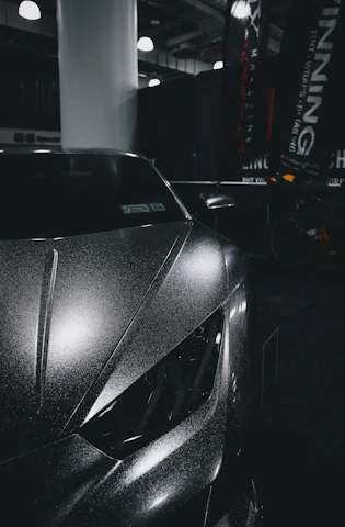 a car parked inside of a garage next to a wall