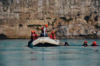 a group of people on a boat in the water