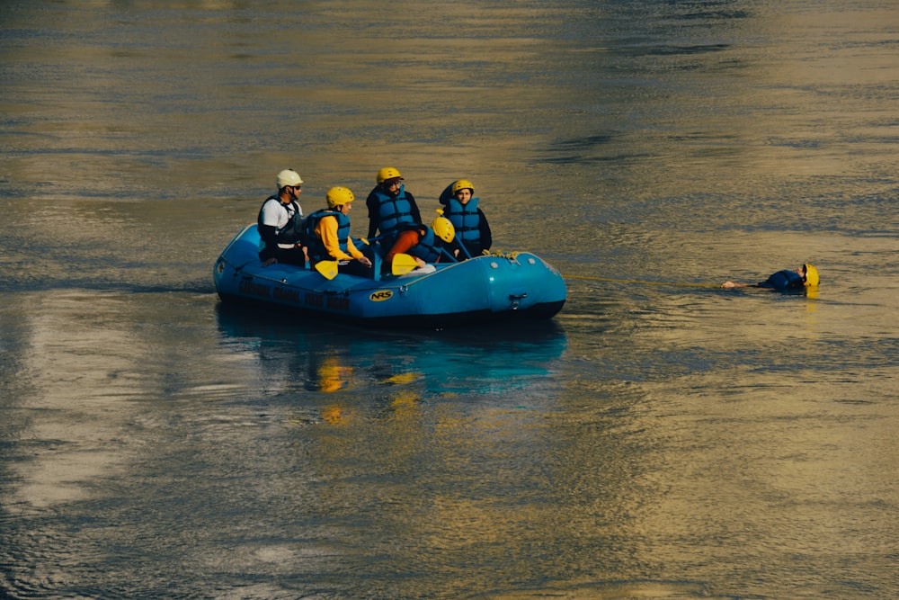 a group of people on a raft in the water