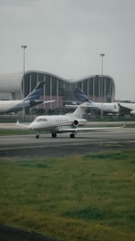 a couple of airplanes that are on a runway