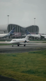 a couple of airplanes that are on a runway