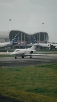 a couple of airplanes that are on a runway