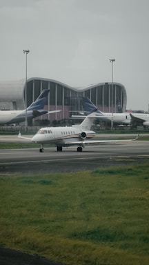a couple of airplanes that are on a runway