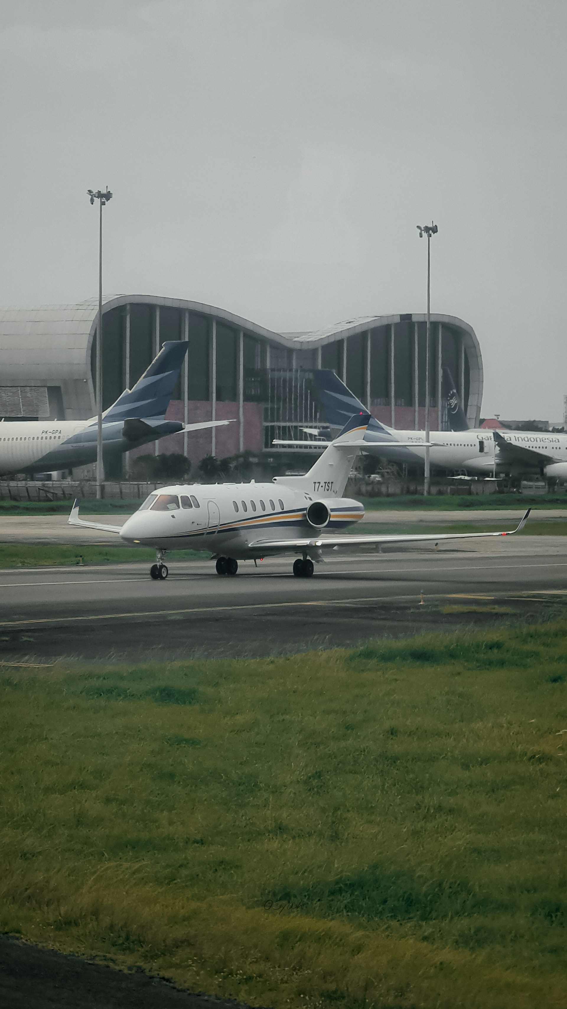 a couple of airplanes that are on a runway
