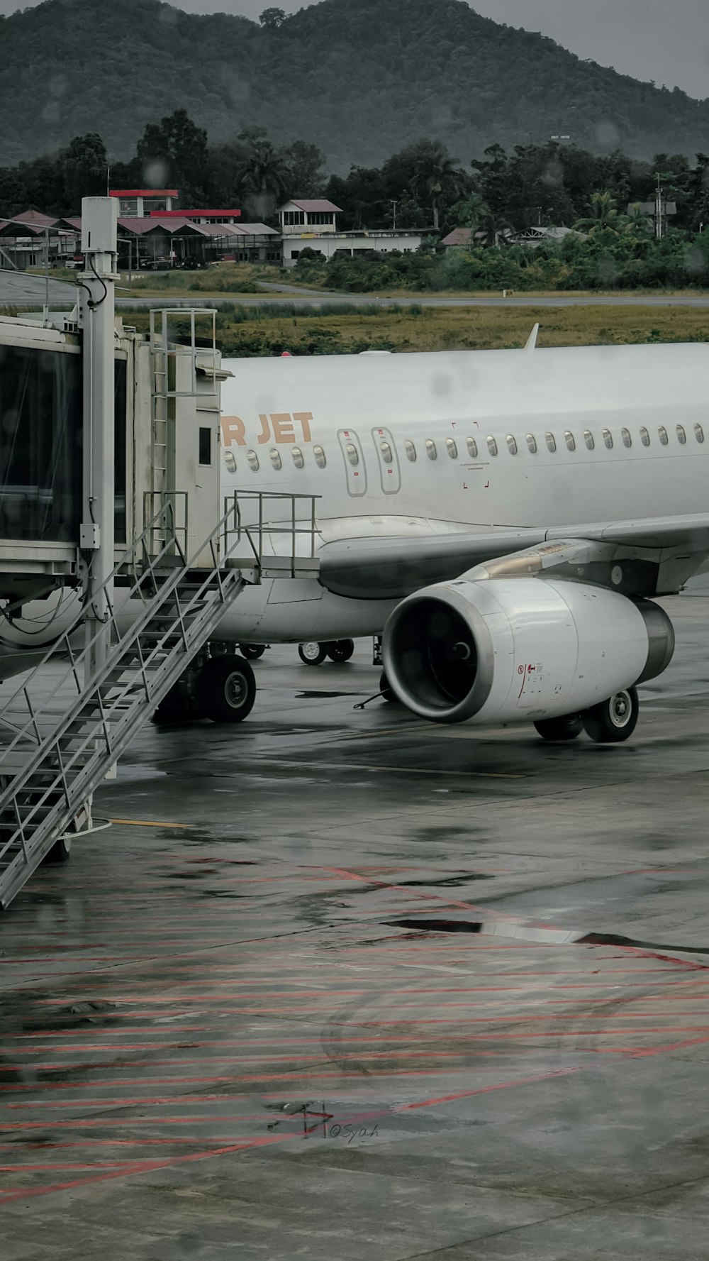 a large jetliner sitting on top of an airport tarmac