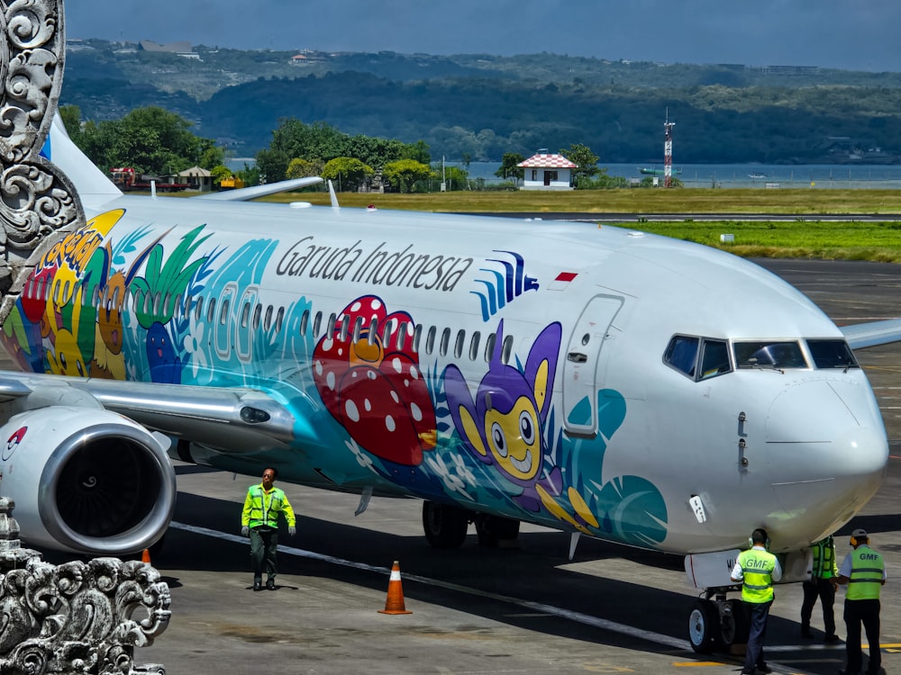 a large passenger jet sitting on top of an airport tarmac