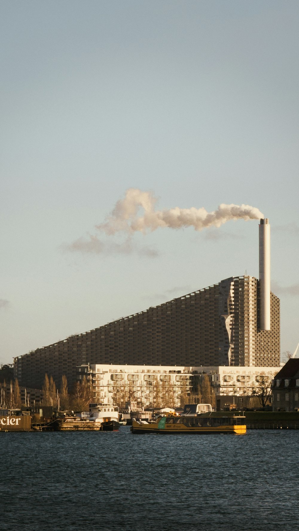 a factory with smoke coming out of it's stacks