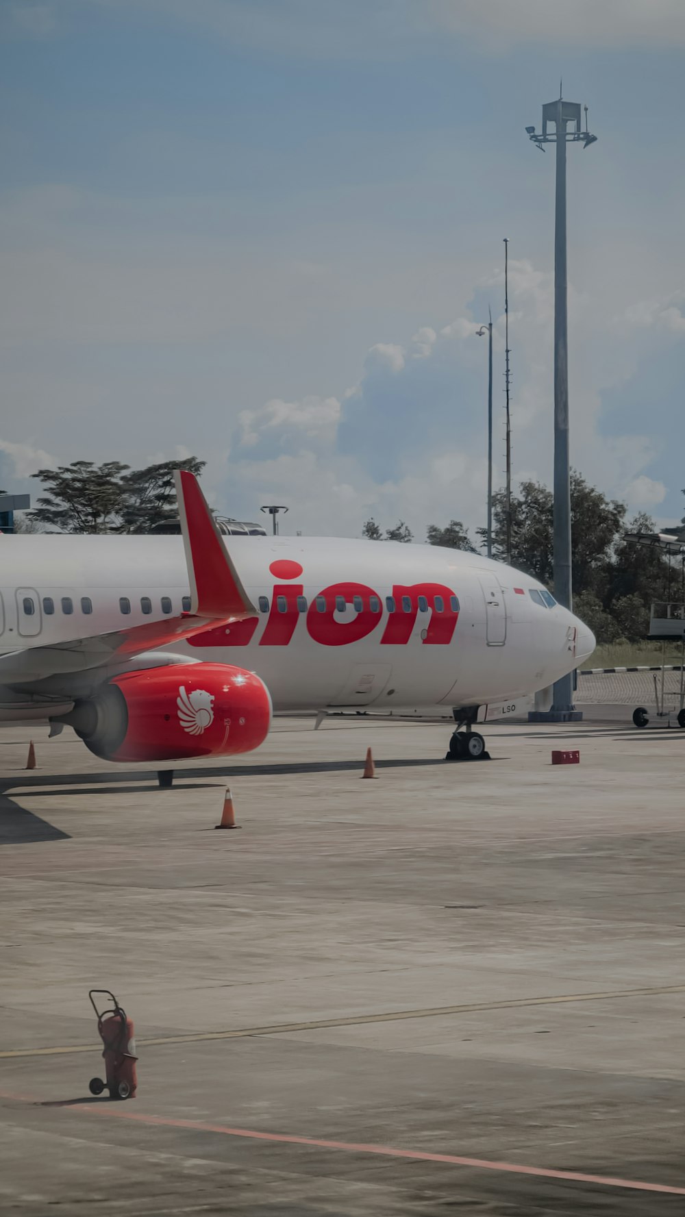 a large jetliner sitting on top of an airport tarmac