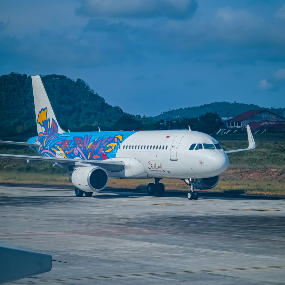 a large passenger jet sitting on top of an airport tarmac