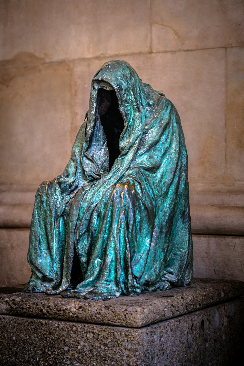 a statue of a person wrapped in a blanket