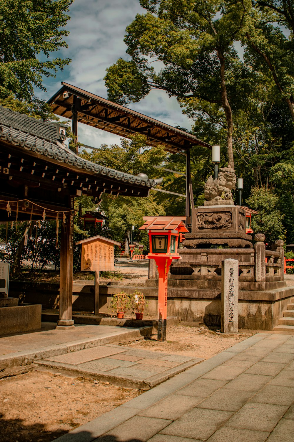 a small shrine in the middle of a park