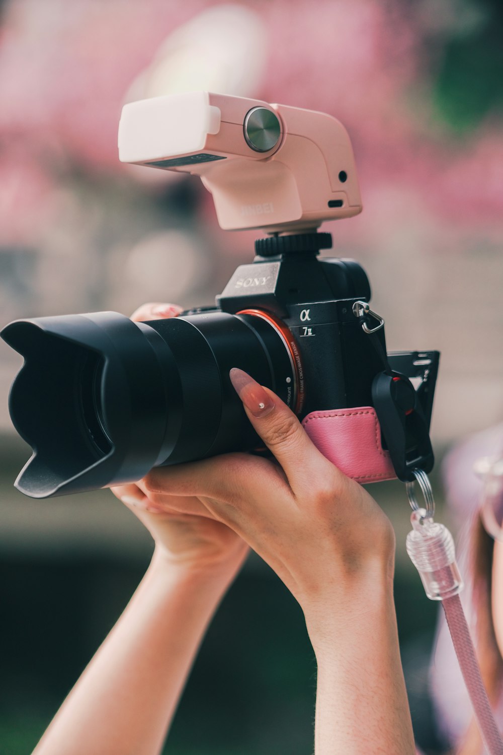 a woman holding a camera up to take a picture