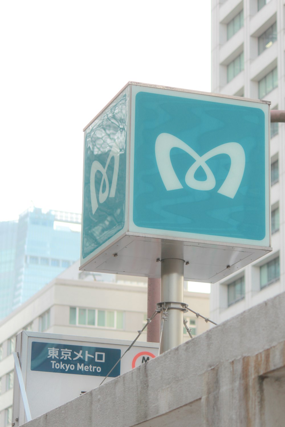 a street sign with a building in the background