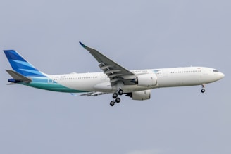 a large jetliner flying through a blue sky