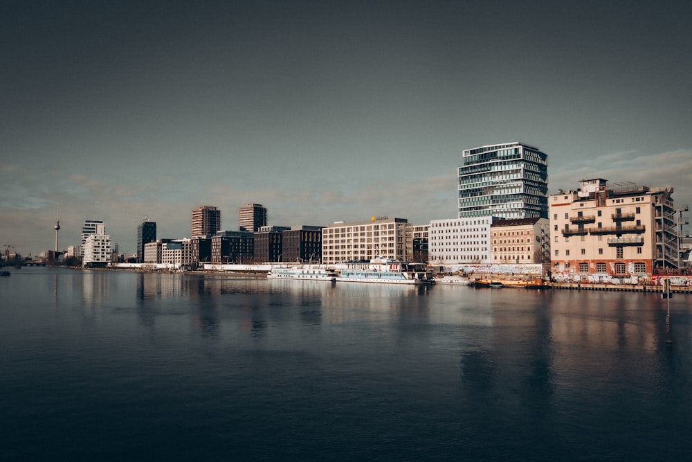 a large body of water with a city in the background