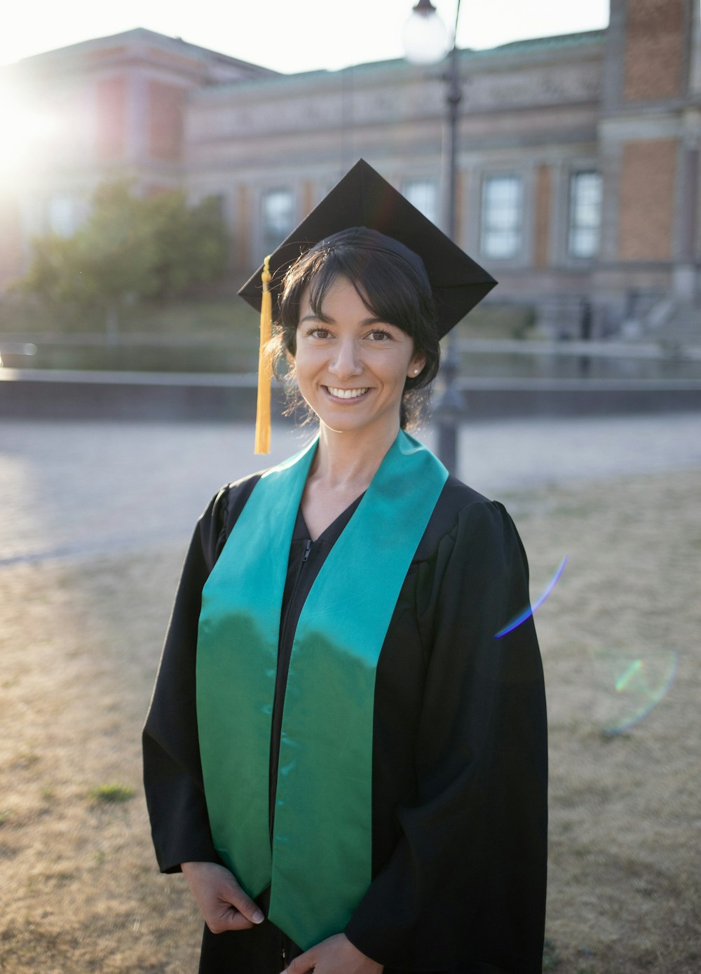 a woman in a graduation cap and gown