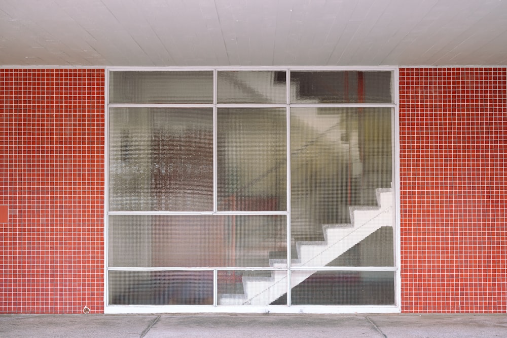 a red and white building with a white stair case