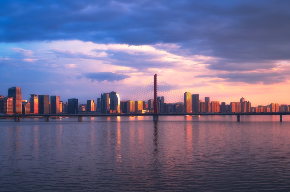 a large body of water with a city in the background