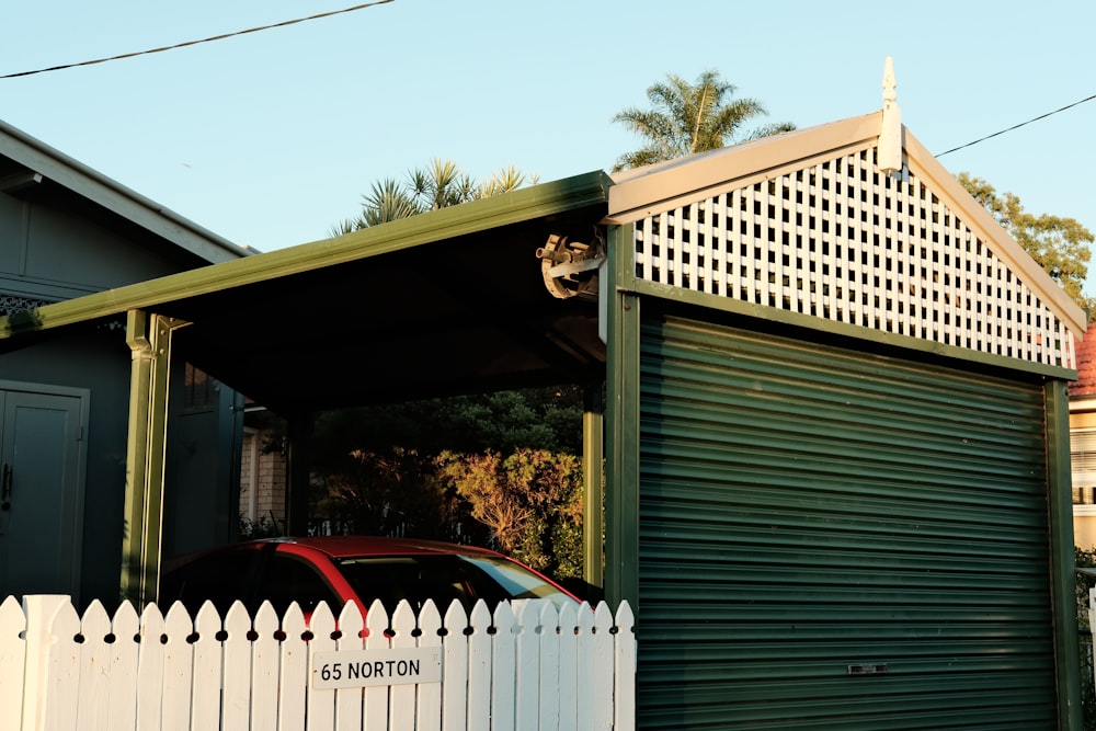 a car is parked in front of a garage