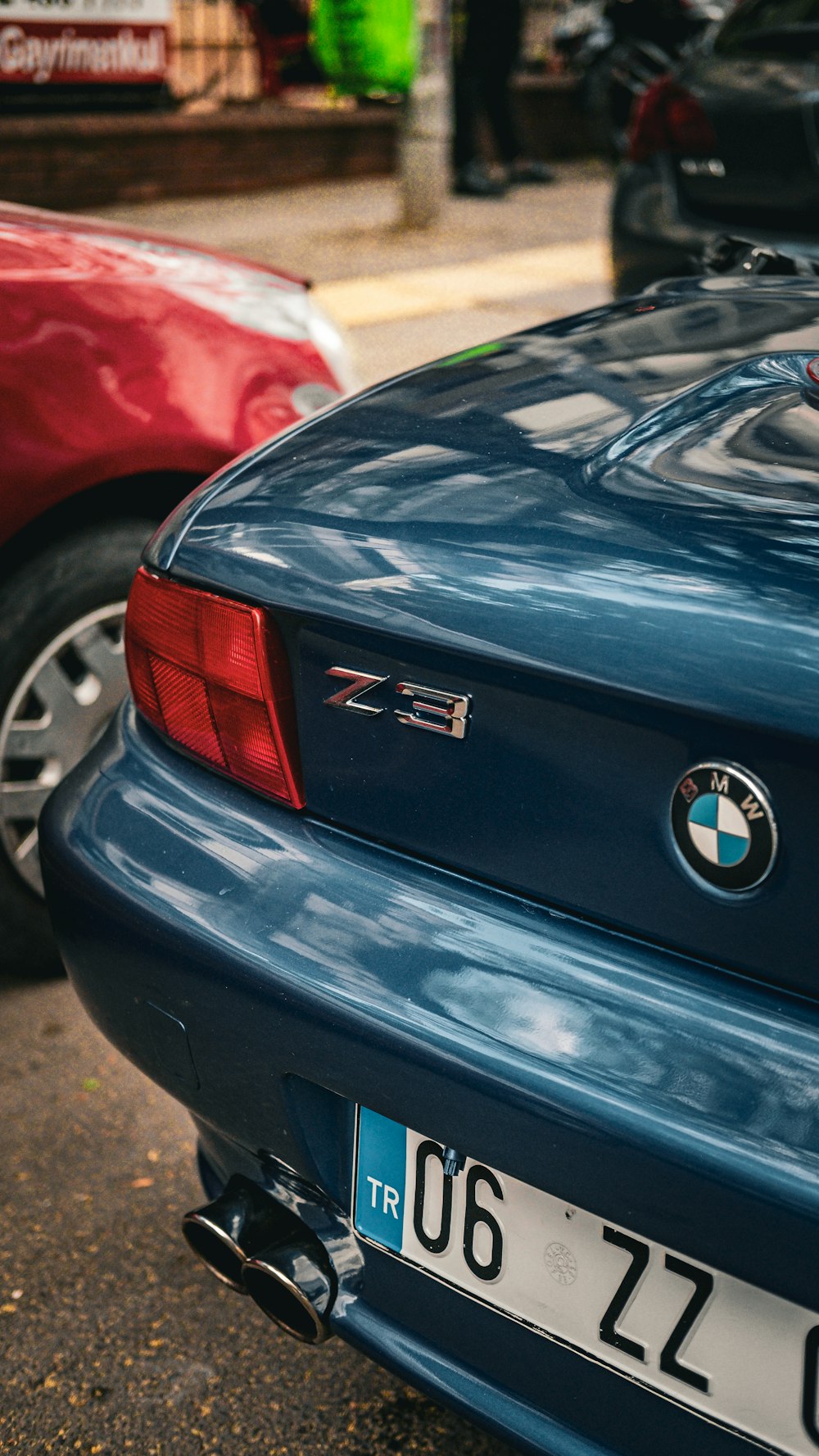 a close up of a car parked on the side of the road