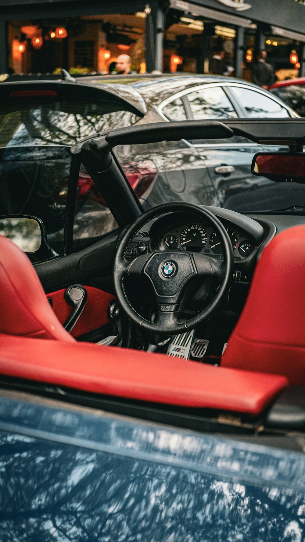 the interior of a car with red leather seats