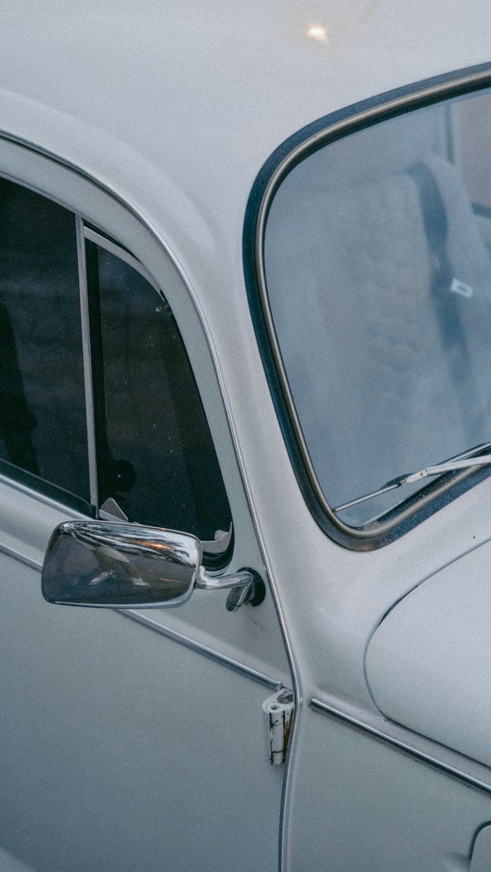 a close up of a car door with a person in it