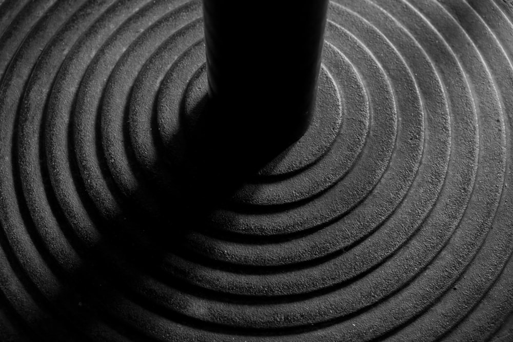 a black and white photo of a coffee cup