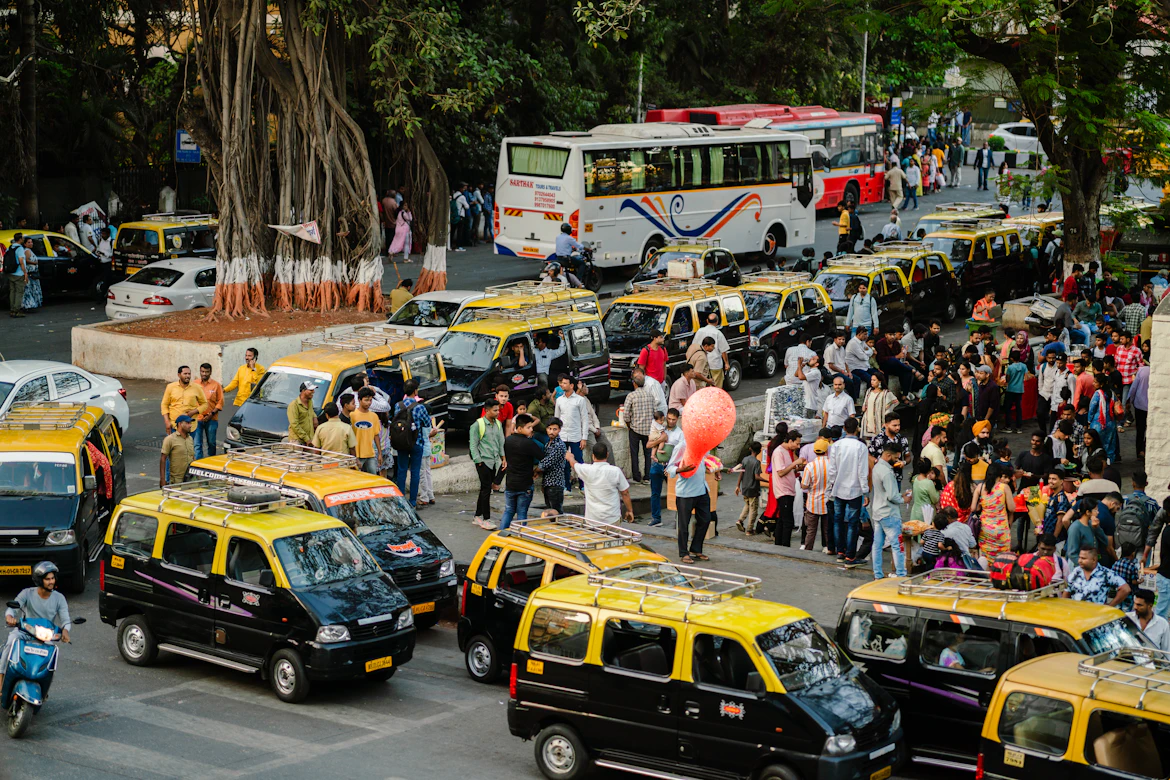 Classic yellow and black Mumbai taxi on the streets