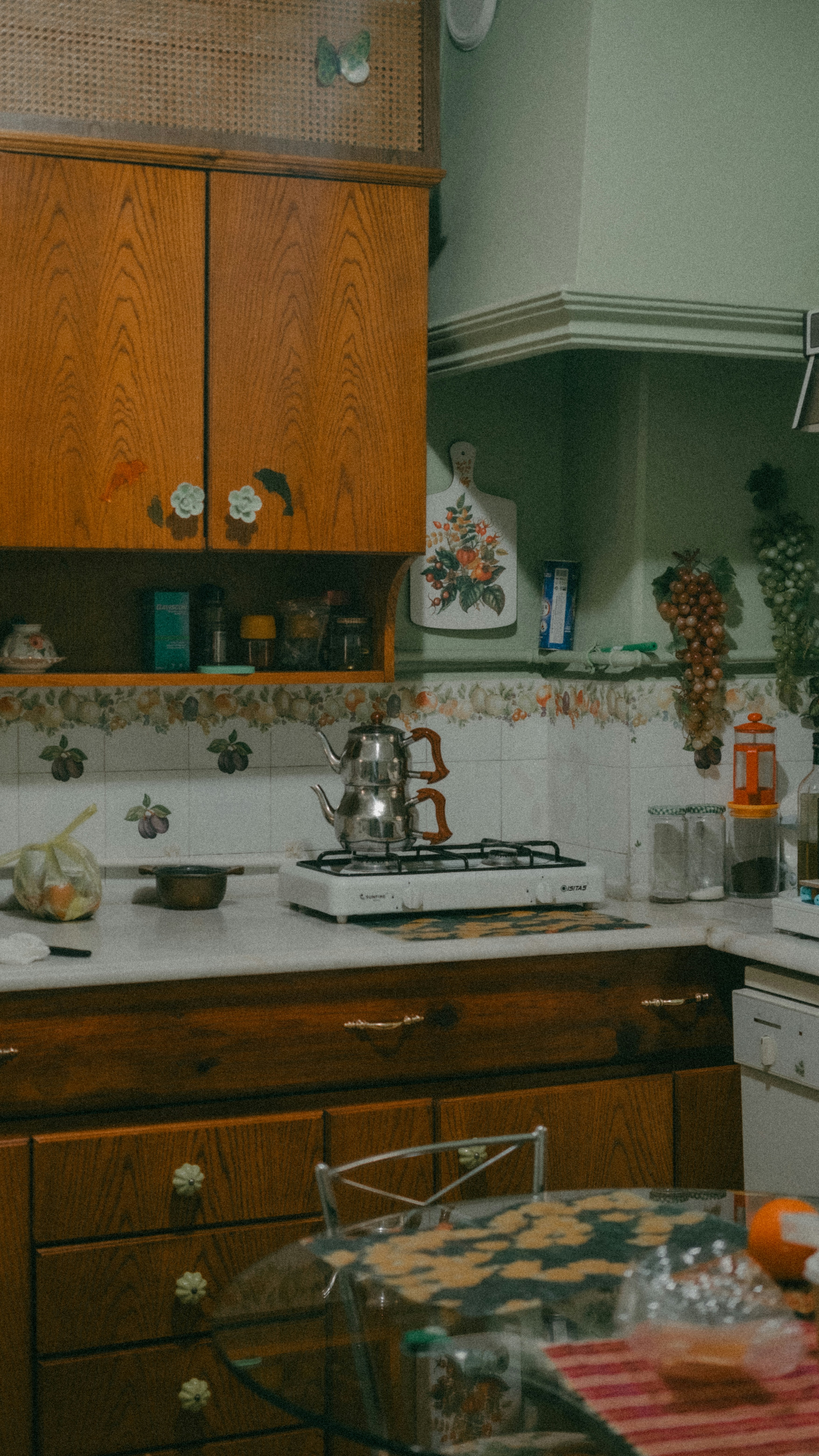 a kitchen with a stove top oven next to a counter