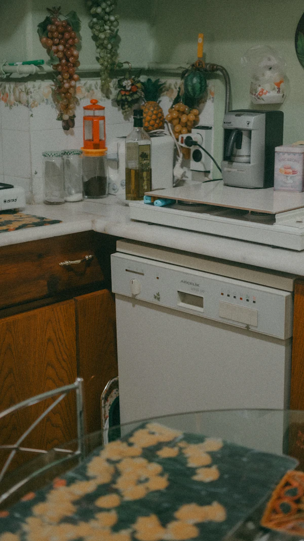 Kitchen with a built-in oven, stove, and microwave