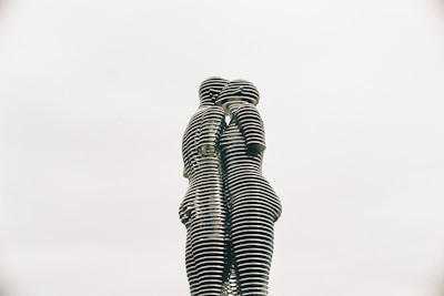 a statue of two people standing next to each other