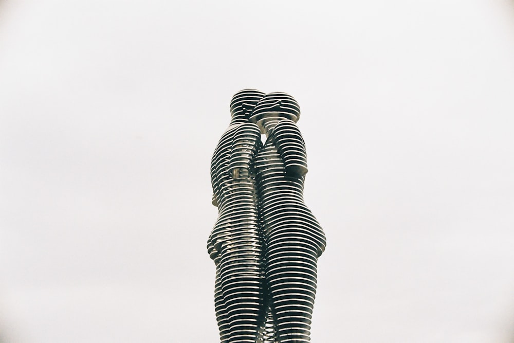 a statue of two people standing next to each other