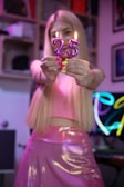 a woman holding a lit candle in her hands
