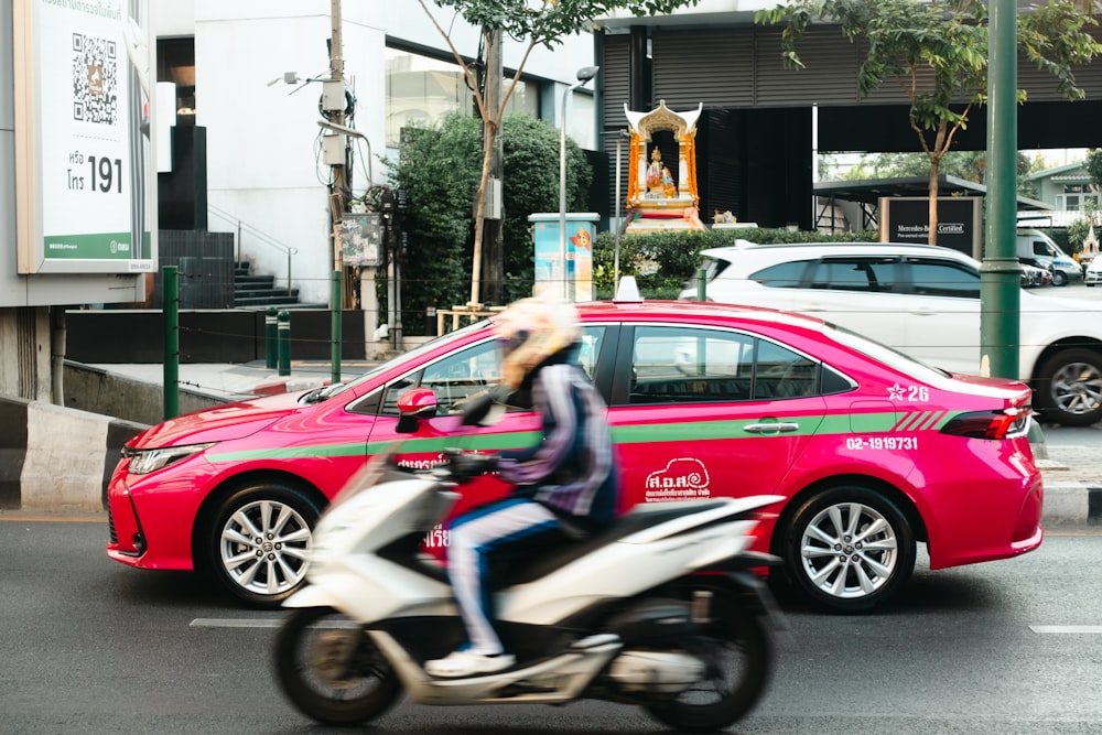 a person riding a motorcycle on a city street