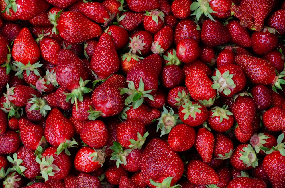 a close up of a bunch of strawberries