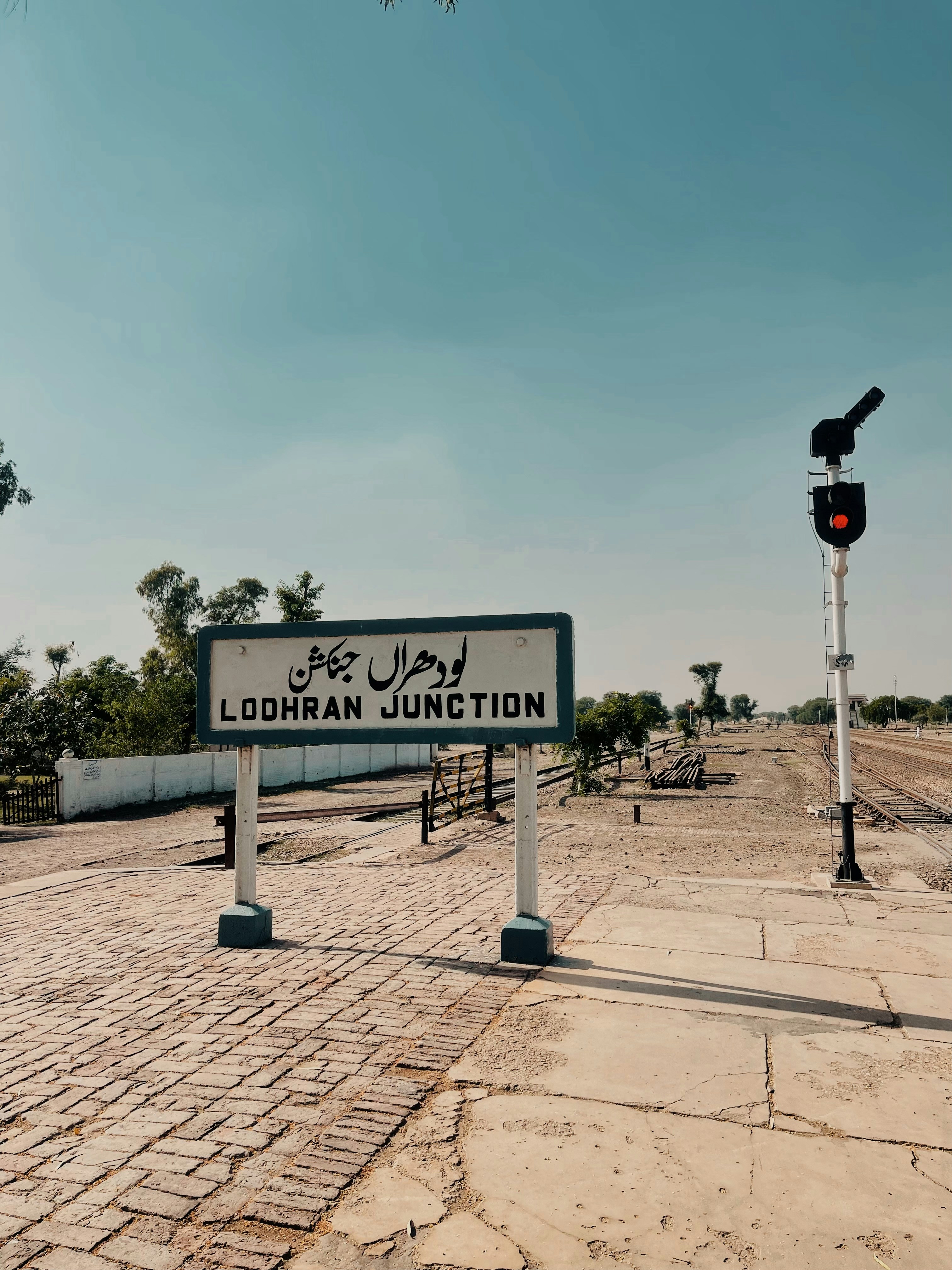 a street sign sitting on the side of a road