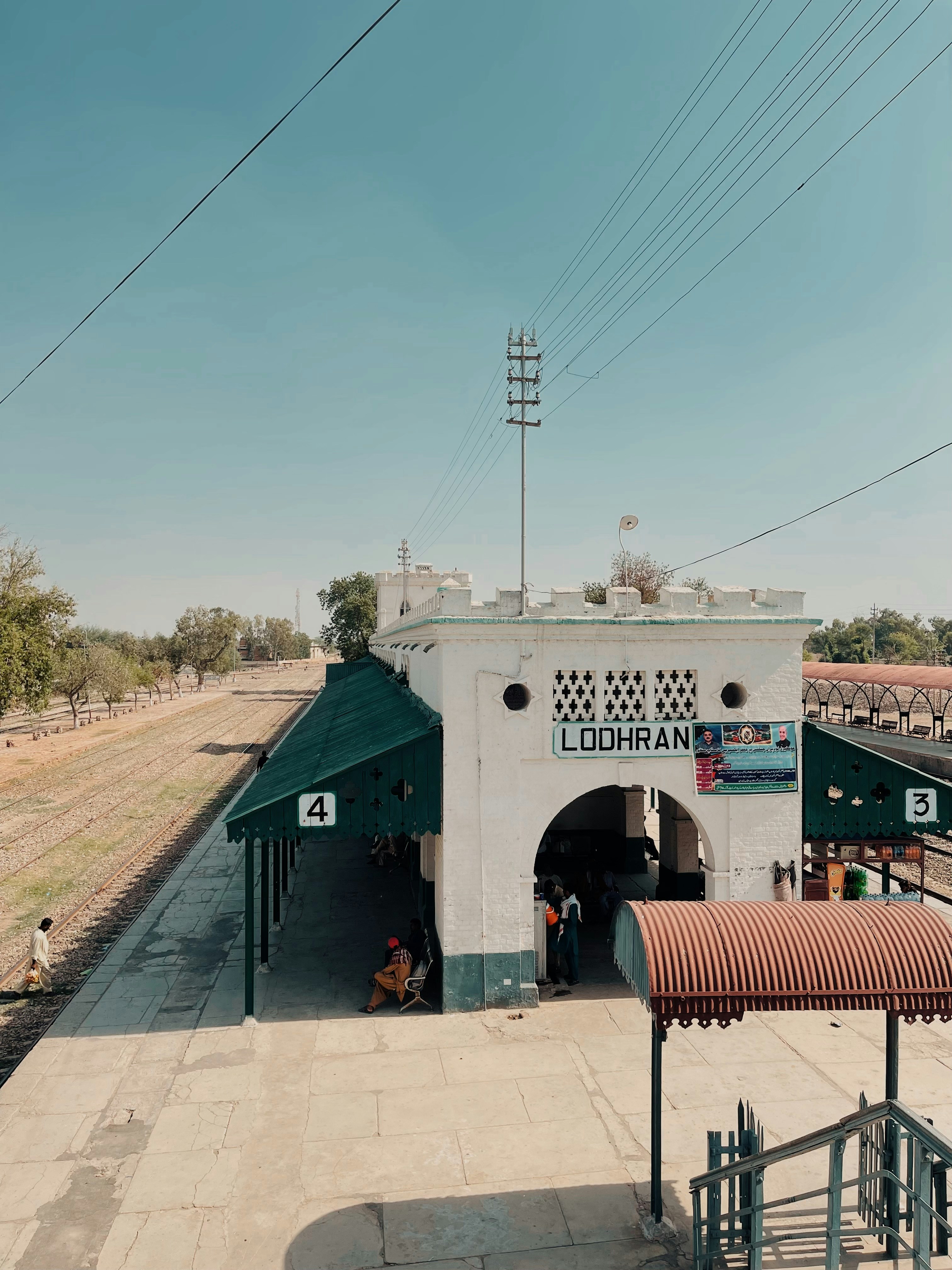 a train station with a train on the tracks