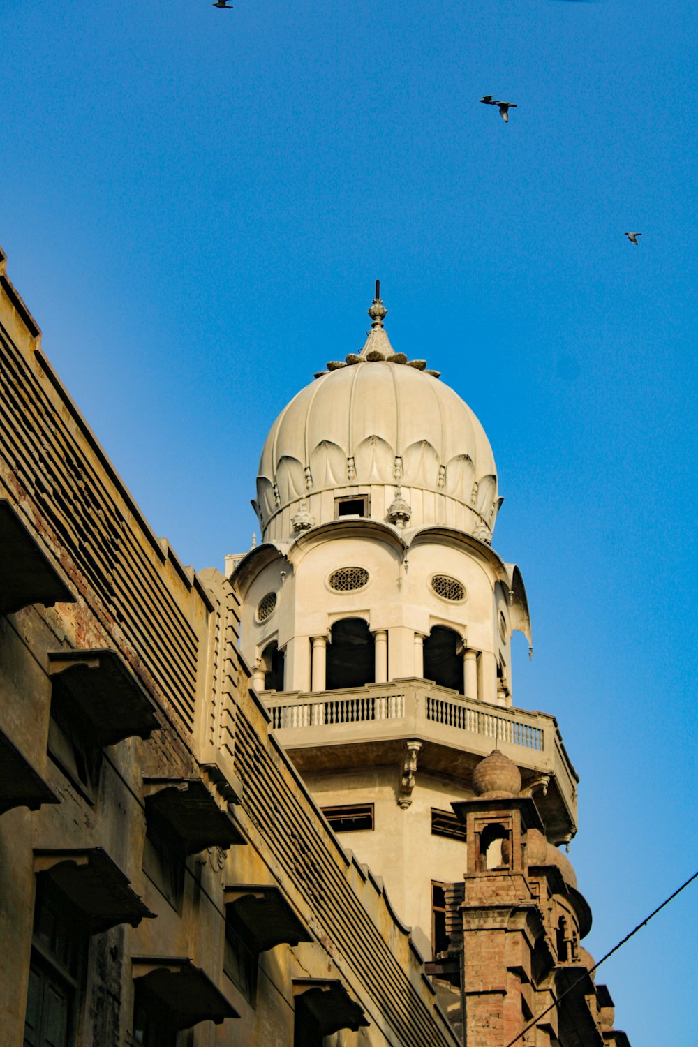 a tall building with a dome on top of it