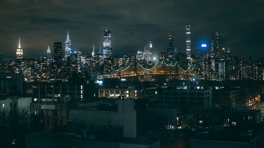 a view of a city at night from a rooftop