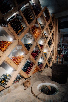 a wine cellar filled with lots of bottles of wine