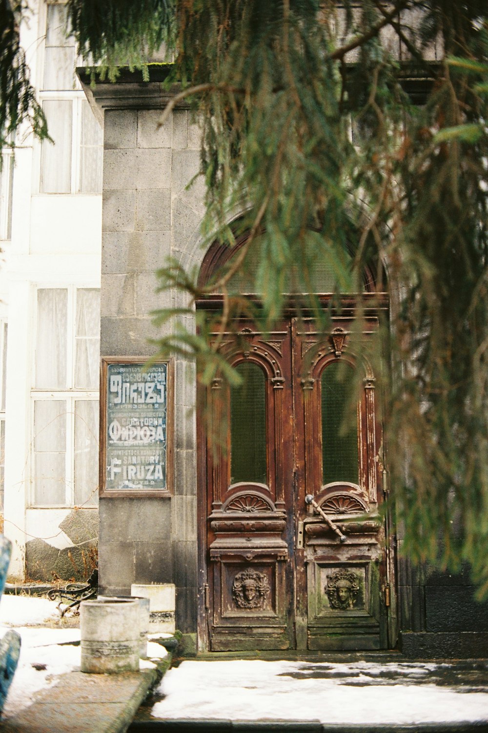 an old building with a wooden door and window