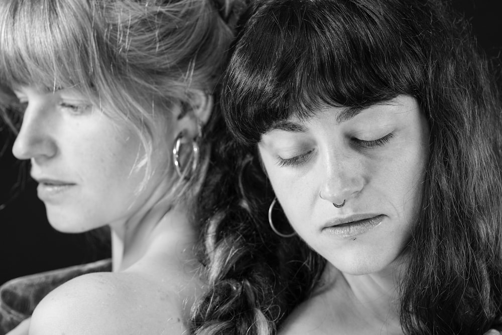 a black and white photo of two women