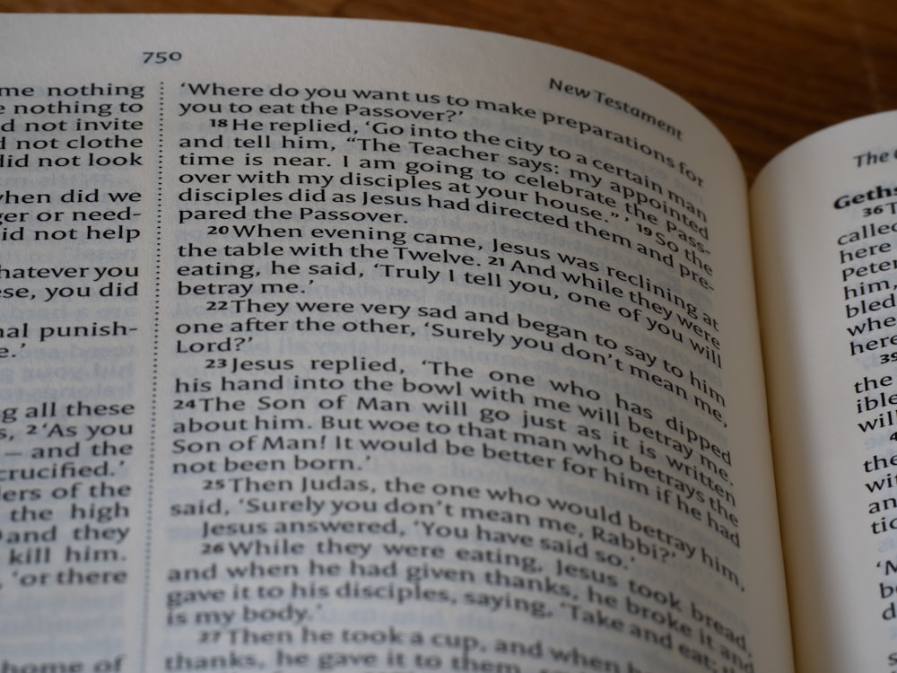 a close up of an open book on a table