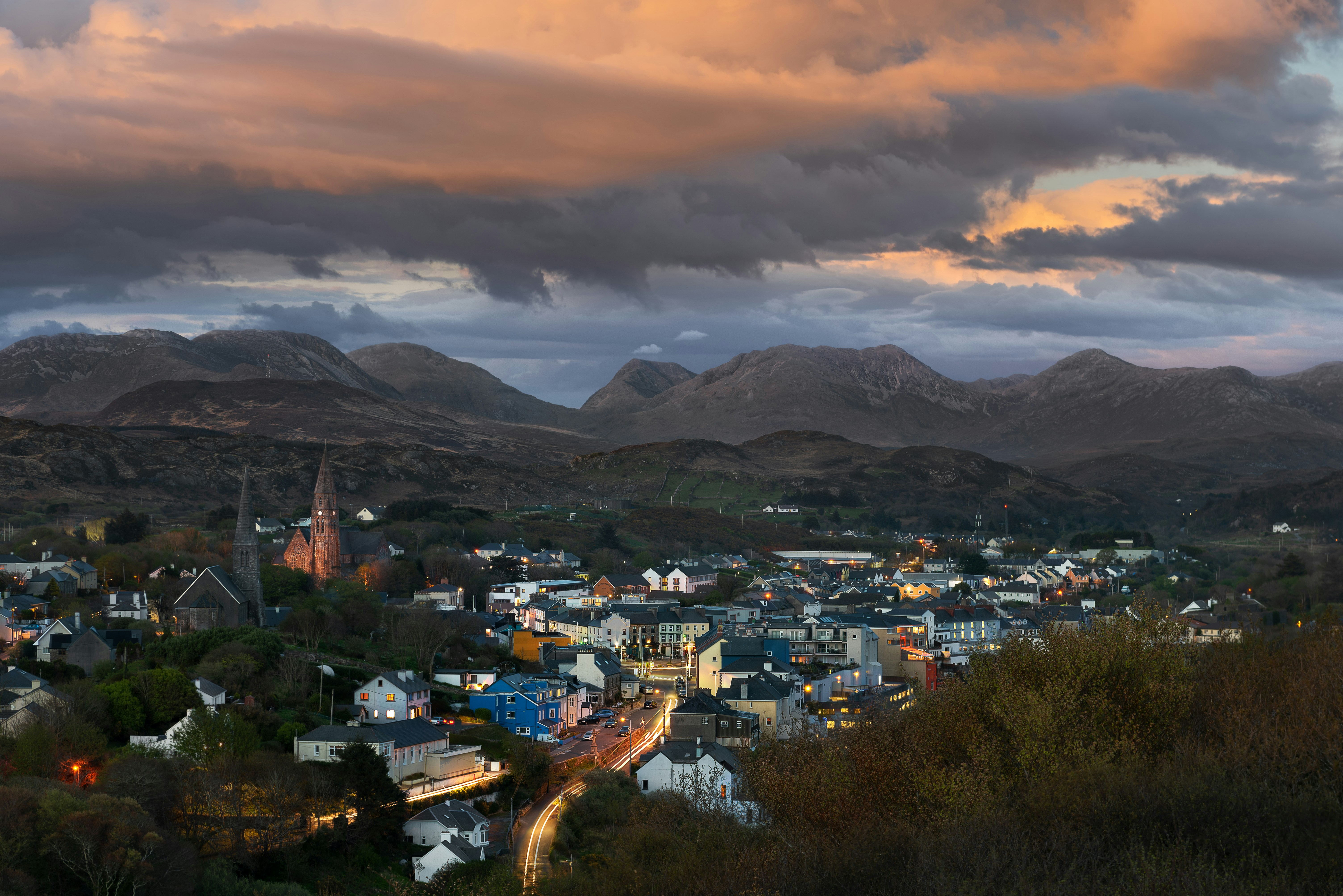 a view of a city with mountains in the background