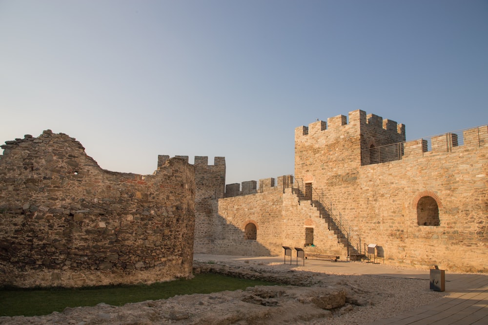 a stone castle with a staircase leading up to it