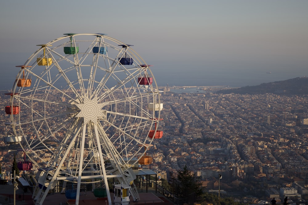 a ferris wheel on top of a tall building