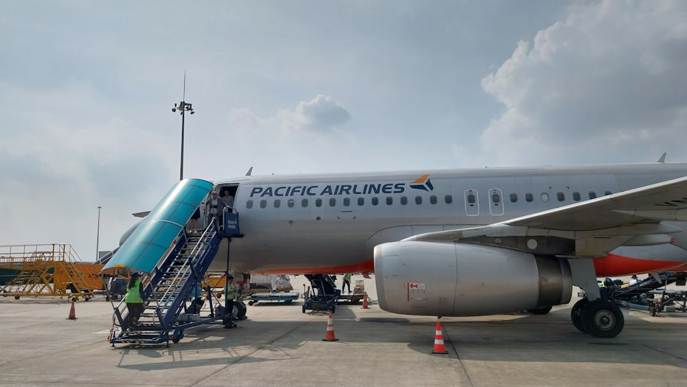 a large jetliner sitting on top of an airport tarmac