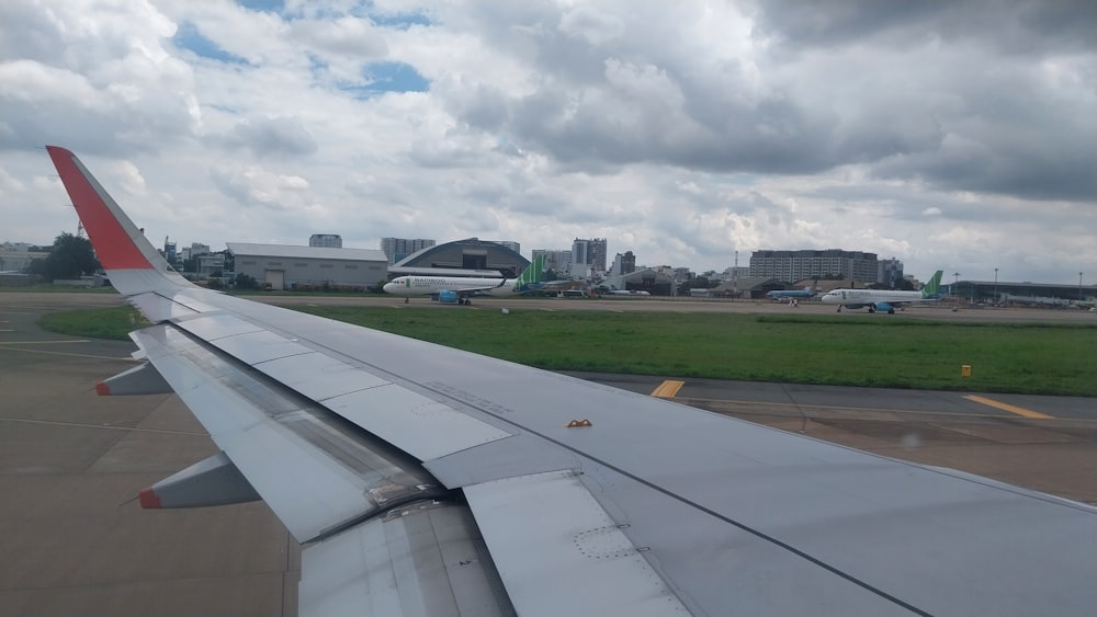 the wing of an airplane on a runway