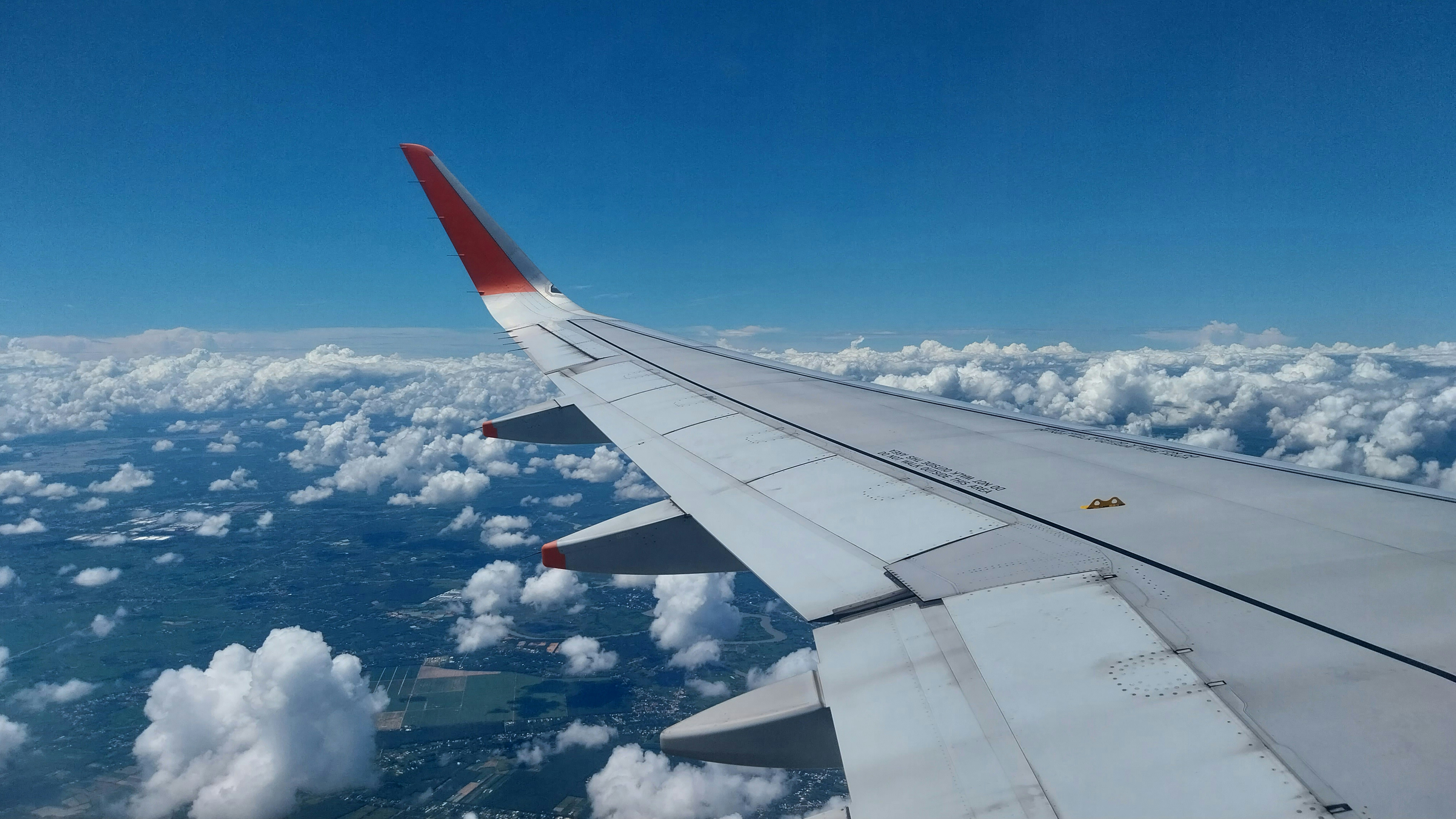 the wing of an airplane flying above the clouds, Pacific Airlines Airbus 320-200 sharklet view on the sky