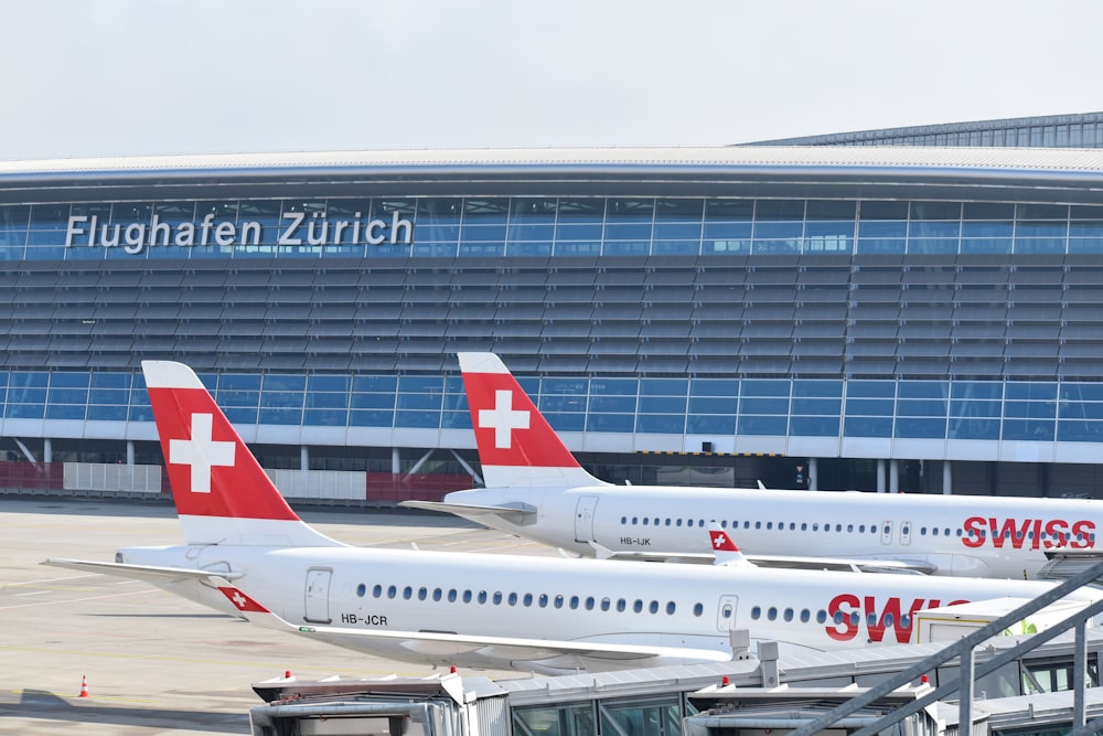 a couple of airplanes that are on a runway